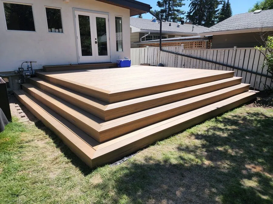 Finished composite deck with broad wraparound steps